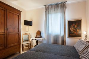 Ліжко або ліжка в номері Francesco Redi Camere