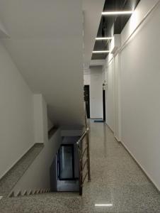 an empty hallway with a staircase in a building at Ap Nou Rezidential Faleza in Galaţi