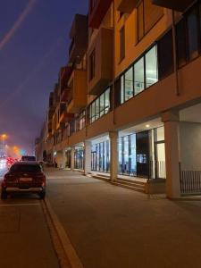 a car parked on a street next to a building at Cloche d'or in Luxembourg