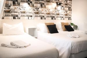 Postel nebo postele na pokoji v ubytování Maria Grazia Hotel