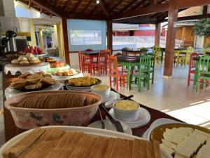 a buffet of food on a table in a restaurant at Solar do Cerrado Hotel in Bonito