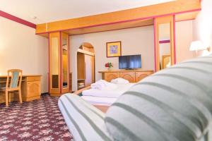 Posteľ alebo postele v izbe v ubytovaní Ferienhotel Alber