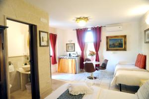 Postel nebo postele na pokoji v ubytování B&B GianLuis