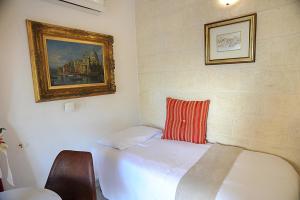 Postel nebo postele na pokoji v ubytování B&B GianLuis