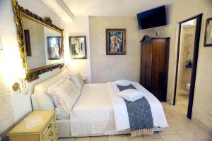 Postel nebo postele na pokoji v ubytování B&B GianLuis