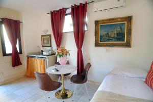 Postel nebo postele na pokoji v ubytování B&B GianLuis