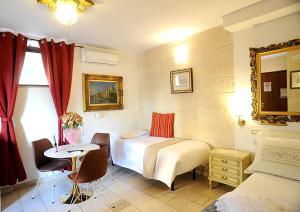 Postel nebo postele na pokoji v ubytování B&B GianLuis