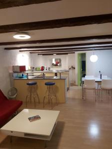 a living room with a kitchen and a table and chairs at Solothurn in Solothurn
