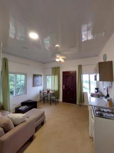 a large living room with a couch and a kitchen at Paradise Venao - Cañas in Cañas