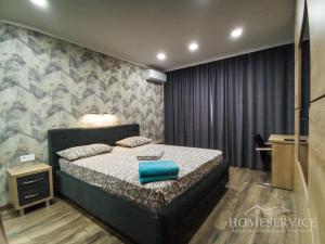 Giường trong phòng chung tại Central Park Chisinau apartments +11 ảnh