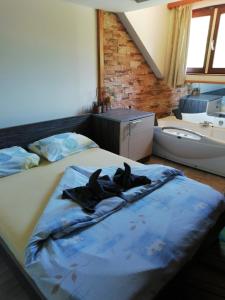a bedroom with two dogs laying on a bed at Ski hotel DOBRODOLAC in Kopaonik
