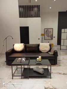 a living room with a couch and a table at Dream Loft in Puente Genil