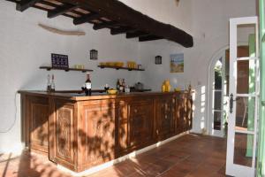 a kitchen with a wooden counter in a room at La Casa Celestial in Platja d'Aro