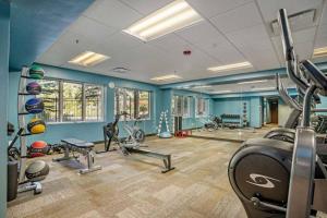 a gym with several exercise equipment in a room at Lodge at Brookside 202 in Avon