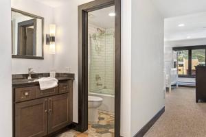 a bathroom with a sink and a toilet and a shower at Lodge at 100 W Beaver Creek Blvd 605 in Avon +43 photos