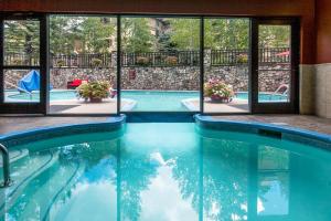 a swimming pool with a view of a building at Beaver Creek Lodge 511 in Beaver Creek