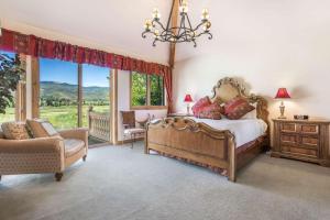 a bedroom with a bed and a chair and a window at Arrowhead Drive 179-W in Edwards +41 photos