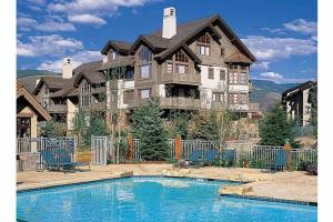 a large house with a swimming pool in front of it at Arrowhead Drive 179-W in Edwards