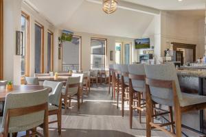 a restaurant with tables and chairs and a bar at Charter at Beaver Creek E125 studio in Beaver Creek