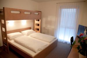 Postel nebo postele na pokoji v ubytování Fair-Price-Hotel