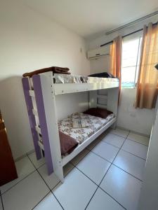 a bedroom with two bunk beds in a room at Shopping Campos Boulevard in Campos dos Goytacazes