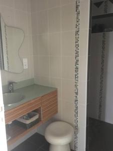 a bathroom with a toilet and a sink at Les genêts in Saint-Alban-sur-Limagnole