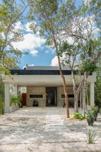 a rendering of a house with trees in the foreground at Luxury private villa-infinity pool&jungle view in Tulum