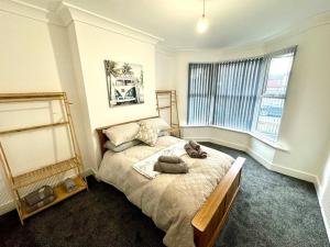a bedroom with a bed with two pillows on it at Antrim Hideaway in Liverpool