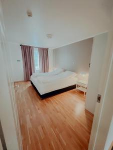 Letto o letti in una camera di Gamli Skólinn Húsavík