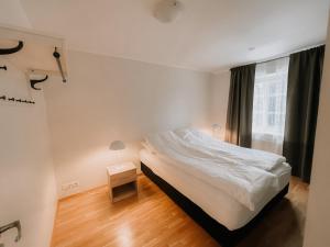 Letto o letti in una camera di Gamli Skólinn Húsavík