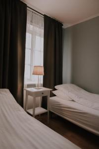 Letto o letti in una camera di Gamli Skólinn Húsavík