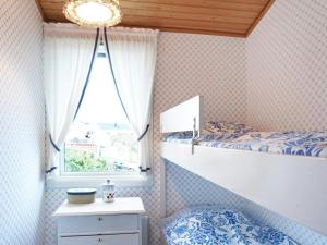 a bedroom with a bed and a window at 4 star holiday home in Bovallstrand-By Traum in Bovallstrand
