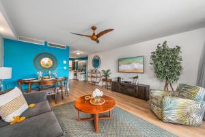 a living room with a couch and a table at Eldorado L102 · EL L102 Renovated 1BD Condo w Pool AC Beach Caba in Kahana