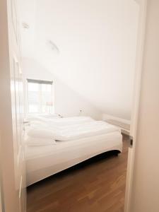 Letto o letti in una camera di Gamli Skólinn Húsavík