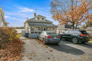two cars parked in front of a house at 154 Pinehurst Dr, Wareham in Wareham