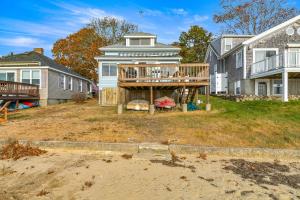 a house with a wooden deck in the yard at 154 Pinehurst Dr, Wareham in Wareham +26 photos