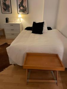 a bedroom with a bed with a wooden tray on it at Privates Zimmer in einem gepflegten Bungalow in Neuss