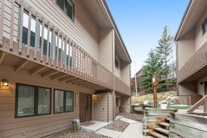 a building with a balcony on the side of it at Windriver Retreat in Teton Village