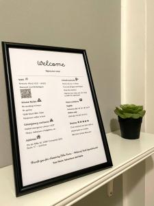 a picture of a menu on a shelf at [Rho Fiera – Milano] Teal Apartment in Cornaredo