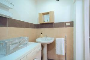 Ванная комната в Central Station Apartment - Sbrijù