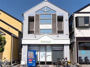 a building with bikes parked in front of it at Soma guest house "mawari" - Vacation STAY 14629 in Soma