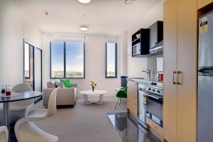 A kitchen or kitchenette at MCentral Apartments Manukau