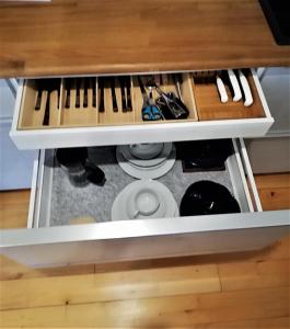 a drawer in a desk with a keyboard at Tæt på Langesø - Apartment near Odense in Morud +24 photos