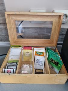 a wooden box filled with different types of food at Hawaii- 2 bdr, Arena, Sava centar, FREE PARKING in Novi Beograd