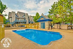 a large swimming pool in front of a house at Mountainview Loft at North Creek Resort in Blue Mountains