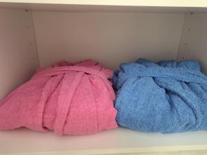 two towels are sitting on a shelf at Apartment Moki in Skopje +23 photos