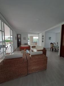 a living room with two couches and a couch at Quinta la Rivera Villavicencio in Villavicencio