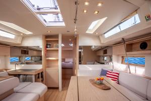 a living room and kitchen in a boat with skylights at Yacht Psari in Thessaloniki