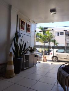 a living room with a view of a parked car at Hotel Vitoria Iracema in Juazeiro do Norte