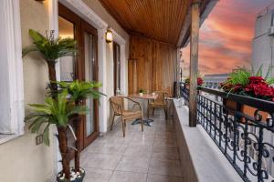 Balkón nebo terasa v ubytování LINNGA HOTEL & SUITE